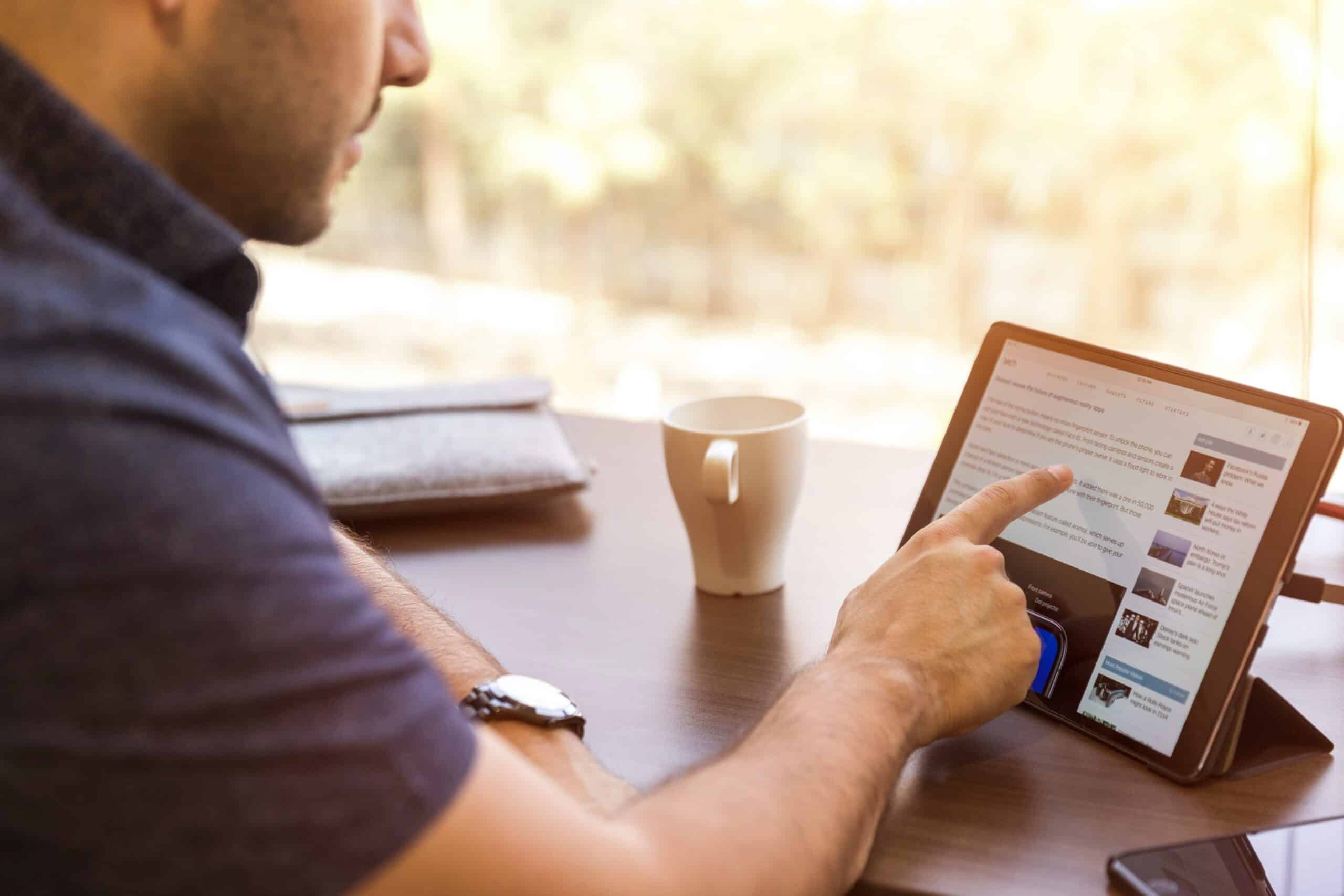 man pointing at screen